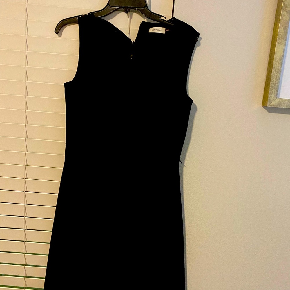 Calvin Klein black dress no sleeves size 8 39 in length waist is 15 in